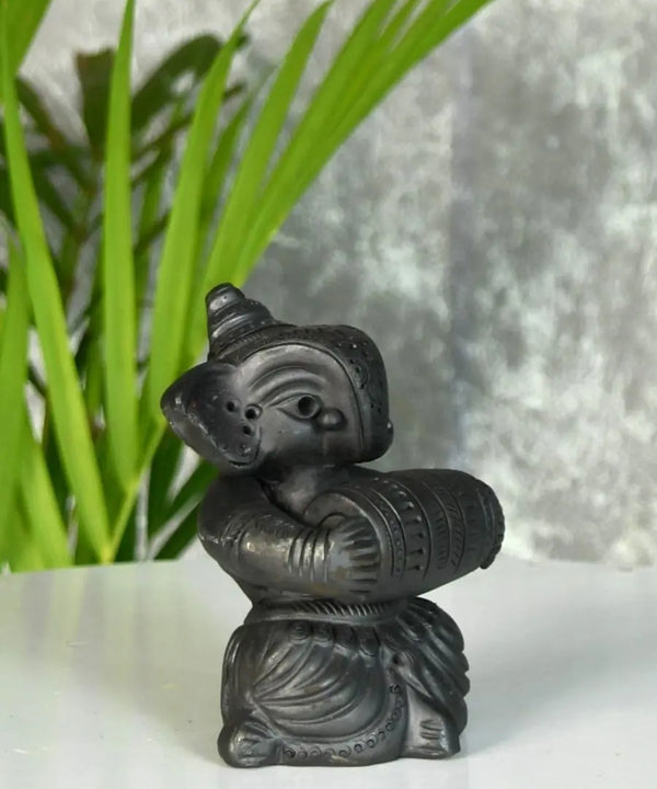 Melodic Mastery: Black Terracotta Ganesh and Tabla Ensemble — image 2