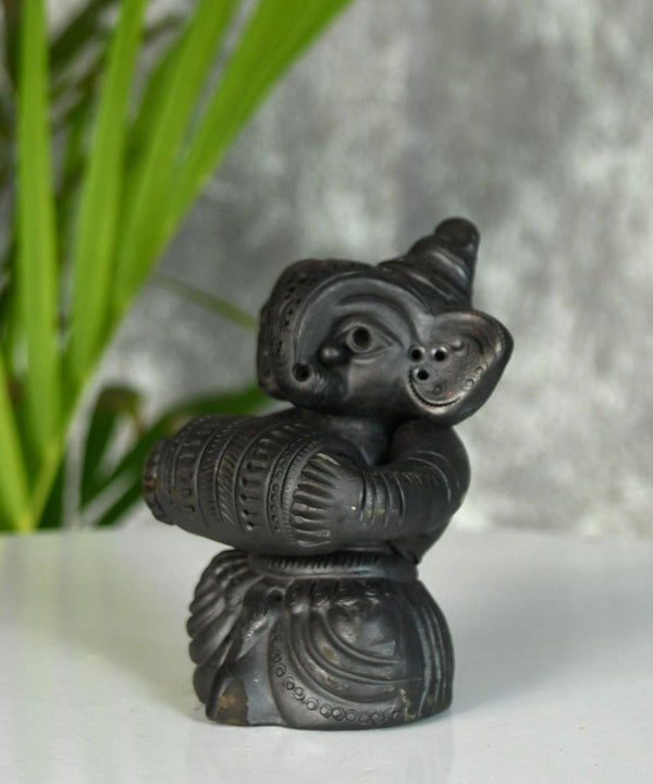Melodic Mastery: Black Terracotta Ganesh and Tabla Ensemble — image 4