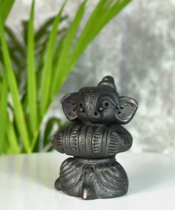 Melodic Mastery: Black Terracotta Ganesh and Tabla Ensemble — main view