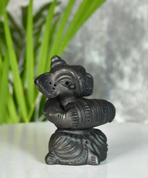 Melodic Mastery: Black Terracotta Ganesh and Tabla Ensemble — image 3
